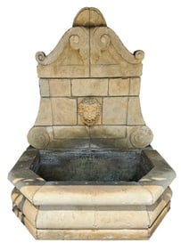 A Neoclassical Carved Limestone Wall Fountain