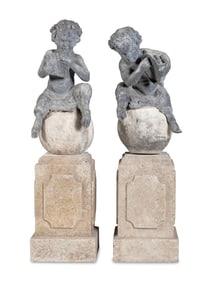 A Pair of Cast Lead Garden Figures of Pan on Associated Cast Stone Bases