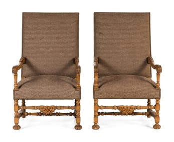 A Pair of Continental Baroque Style Carved Walnut Armchairs