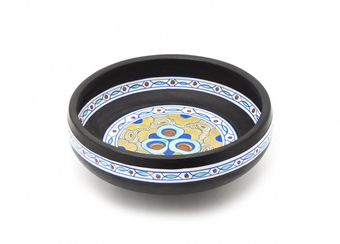 A Continental Enameled Center Bowl, Boch Freres, Diamet: A Continental Enameled Center Bowl, Boch Freres, with stylized polychrome decoration throughout. Diameter 11 inches. Property from the Collection of A. H. Alwan, Milwaukee, Wisconsin
