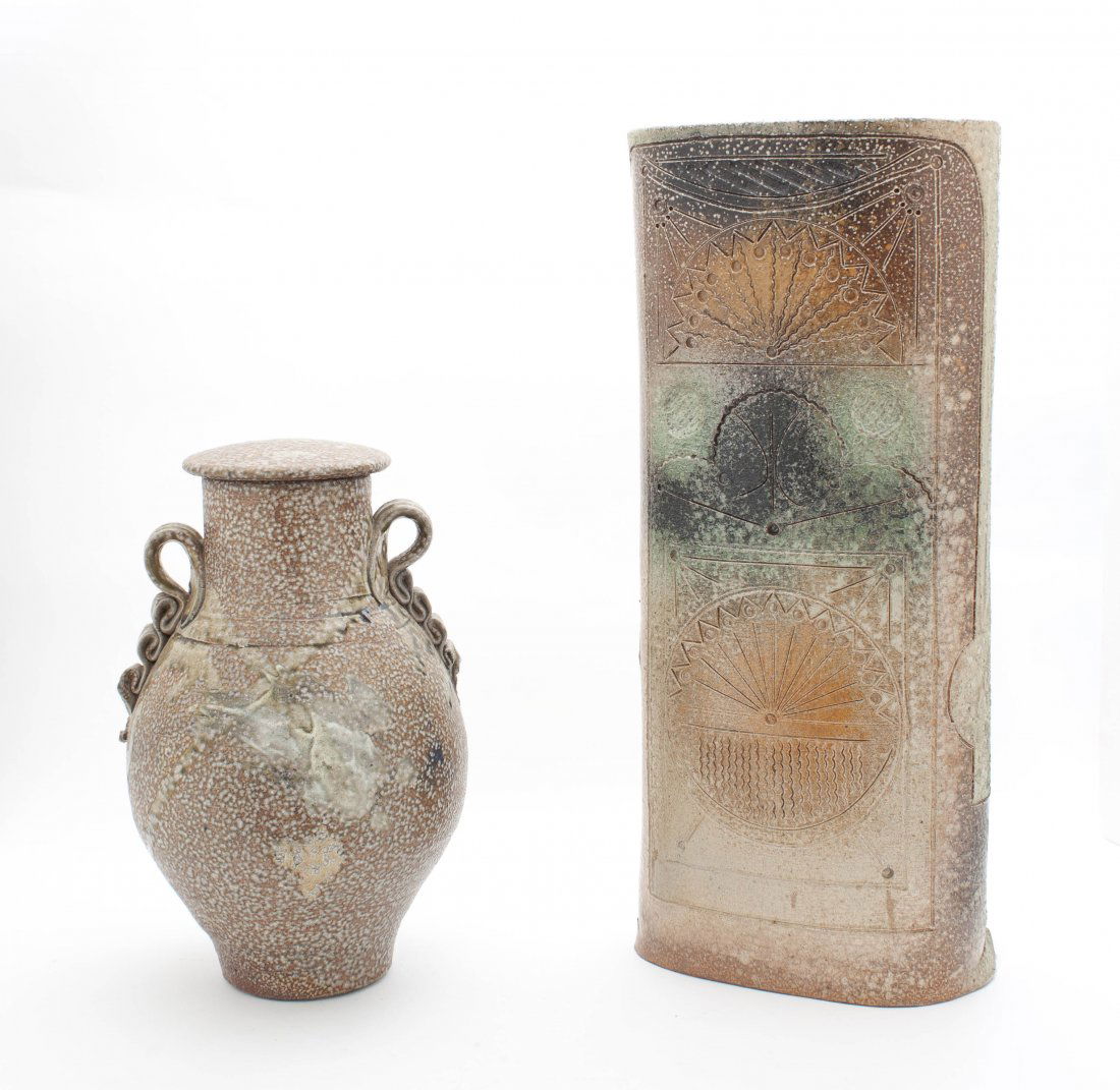Two Studio Ceramic Articles, Don Reitz, Height of talle: Two Studio Ceramic Articles, Don Reitz, comprising a covered vase with applied handles and flattened cylindrical ornament with incised geometric decoration. Height of tallest 18 3/4 inches.