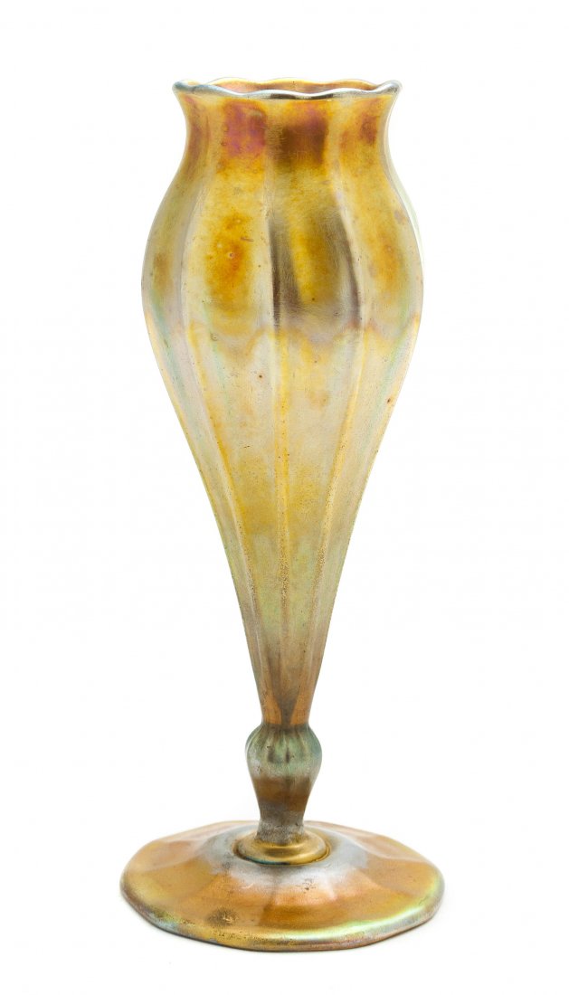 A Tiffany Studios Favrile Glass Vase, Height 8 1/2 inch: A Tiffany Studios Favrile Glass Vase, with gold iridescence and a circular foot, etched L.C. Tiffany Favrile 3020F. Height 8 1/2 inches.