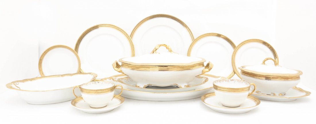 A Limoges Dinner Service, W. M. Guerin and Company, Dia: A Limoges Dinner Service, W. M. Guerin and Company, having gilt geometric edging, comprising 12 dinner plates, 11 luncheon plates, 12 dessert plates, 12 bread plates, 12 bowls, 24 saucers, 11 broths, 