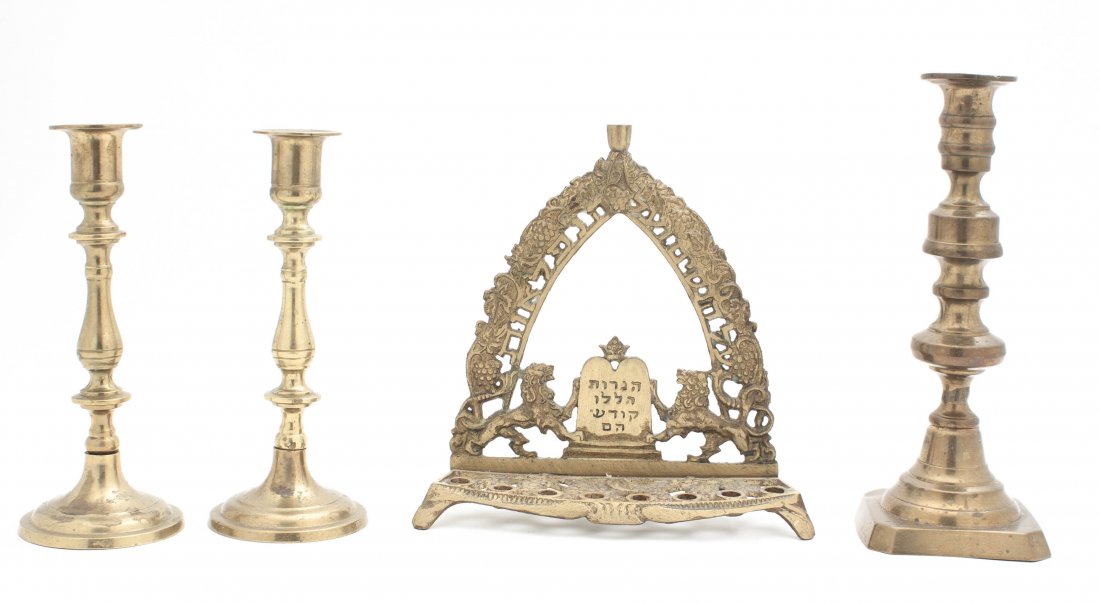 Four Brass Decorative Articles, Height of tallest 8 7/8: Four Brass Decorative Articles, comprising three candlesticks and a Menorah. Height of tallest 8 7/8 inches. Property from the Collection of Marshall and Natalie Feld, Milwaukee, Wisconsin