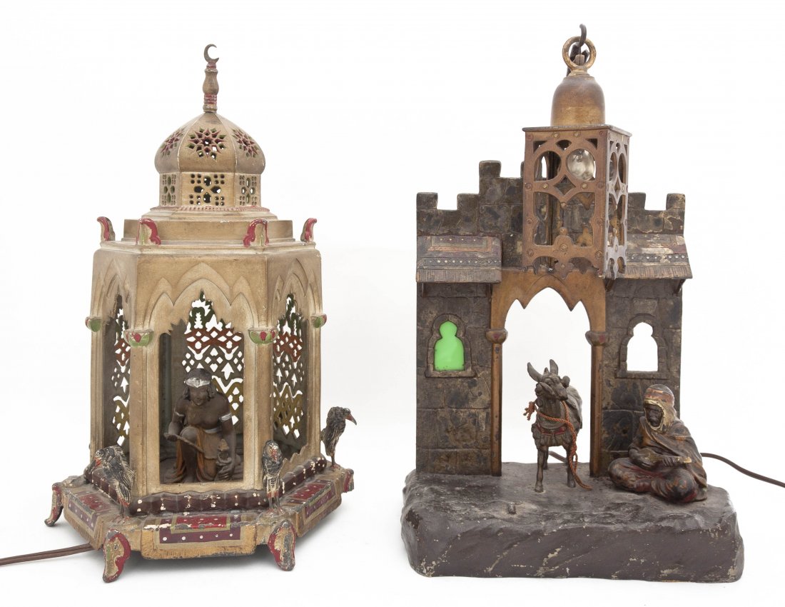 Two German Spelter Figural Lamps, Height of tallest 15: Two German Spelter Figural Lamps, both of Middle Eastern subject matter, one of a figure within an Islamic temple guarded by birds, the other of a street scene depicting a musician and his donkey. Hei