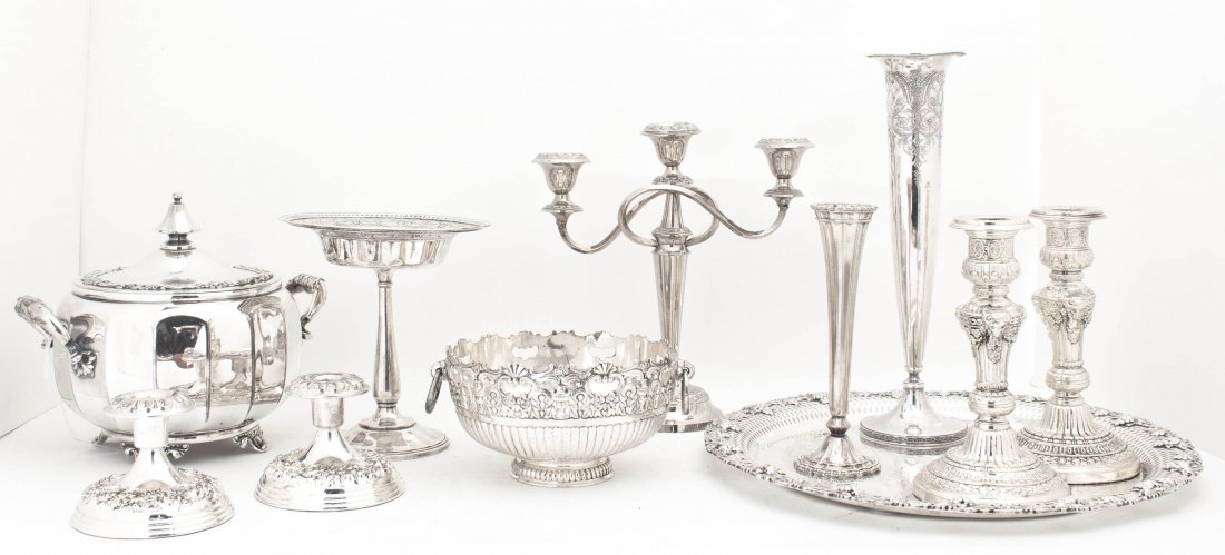 A Collection of Silverplate Table Articles, Diameter of: A Collection of Silverplate Table Articles, comprising two pairs of candlesticks, a candelabrum, two trumpet vases, a compote, a soup tureen, a bowl and a round reticulated tray. Diameter of tray 12 i