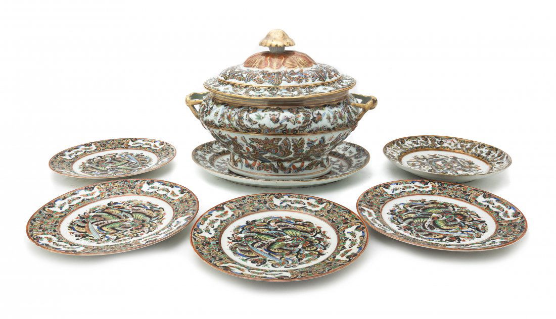 A Chinese Porcelain Partial Dinner Service, Length of p: A Chinese Porcelain Partial Dinner Service, comprising a tureen with undertray and five plates, having enameled butterfly decoration. Length of platter 14 inches.
