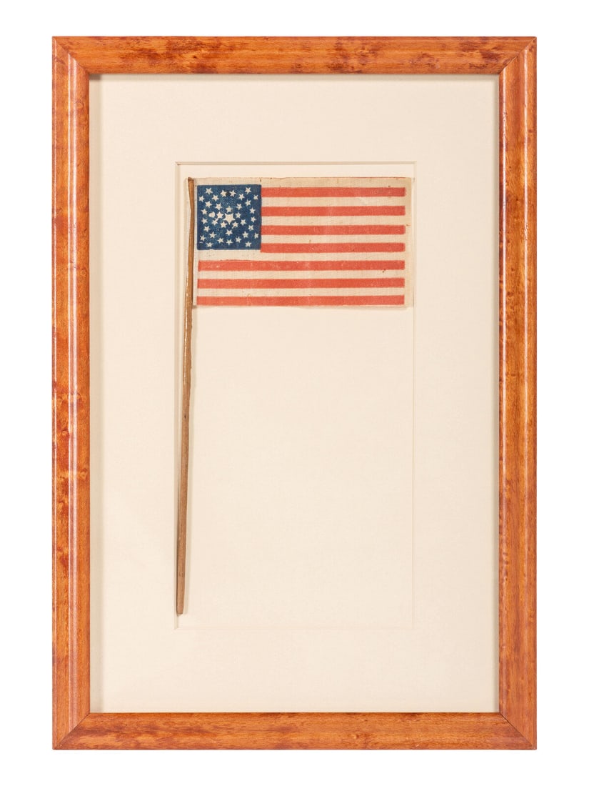 [FLAGS]. 36-star American parade flag in a rare "Great-Star-in-a-Wreath" pattern. Ca 1865-1867. (1 of 2)