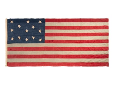 [FLAGS]. 13-star American Centennial flag with unusual star pattern. Ca late 19th century.