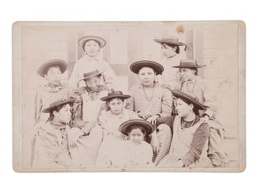 [NATIVE AMERICANS]. Cabinet card of female Indian School students with ledger drawing on verso.
