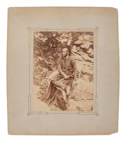HILLERS, John K. (1843-1925), photographer. Photograph of an Osage warrior holding a tomahawk.