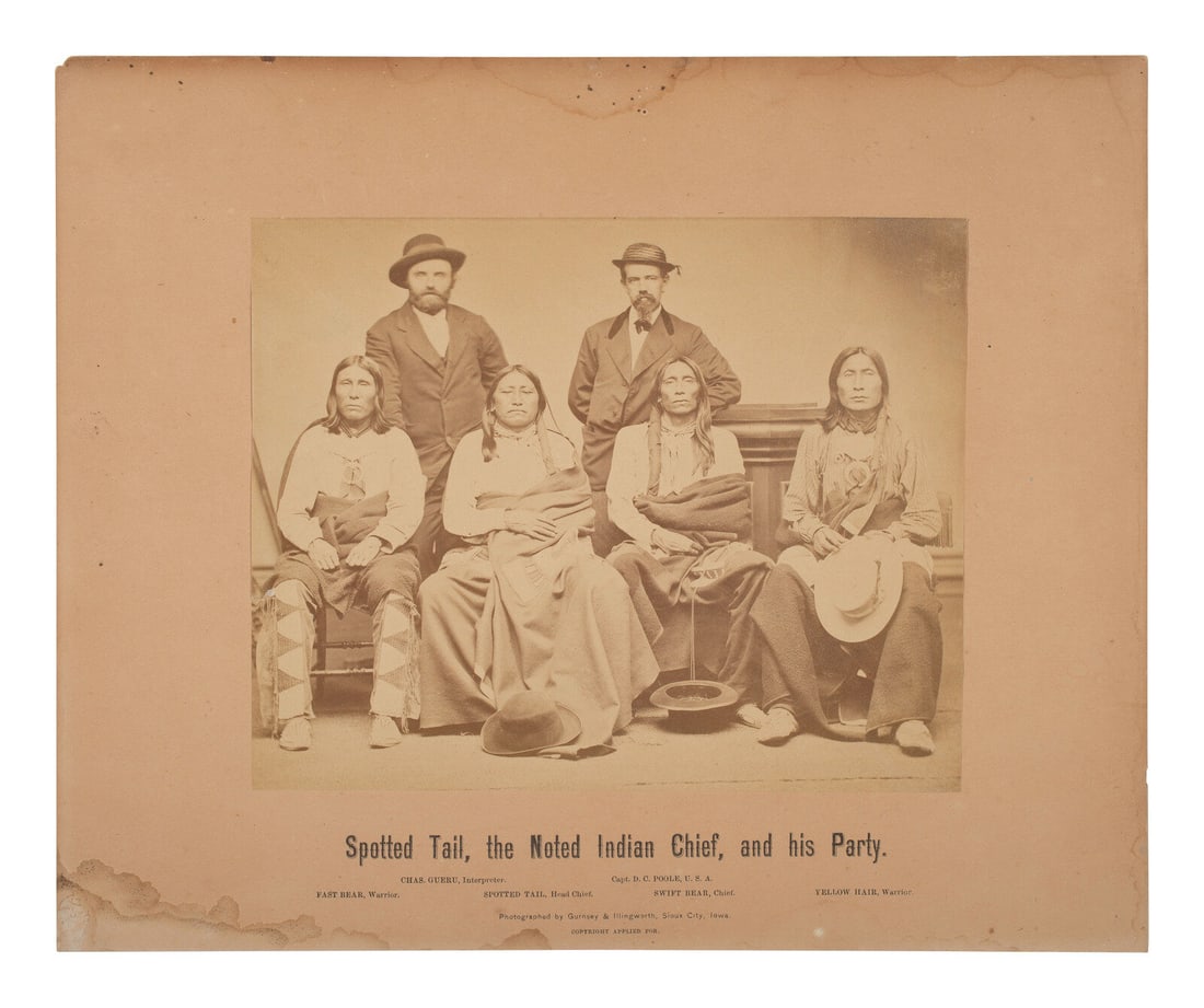 GURSNEY & ILLINGWORTH, photographers. Spotted Tail, the Noted Indian Chief, and his Party. Sioux: GURSNEY & ILLINGWORTH, photographers. Spotted Tail, the Noted Indian Chief, and his Party. Sioux City, Iowa, [ca June 1870]. 6 1/8 x 7 5/8 in. albumen photograph on 9 3/4 x 11 3/4 in. cardstock mo