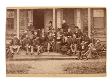 [LITTLE BIGHORN]. Cabinet card group portrait of 17th Infantry officers and their female friends