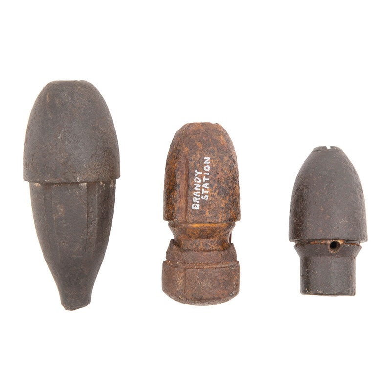 Three Excavated Civil War Era Artillery Shells Including Schenkl and Hotchkisses: Three Excavated Civil War Era Artillery Shells Including Schenkl and Hotchkisses American Civil War 1) Dug 6 Pound Rifled Gun Schenkl Case Shot. Nominally 8.75" in length and 3.5" in diameter. Disarme