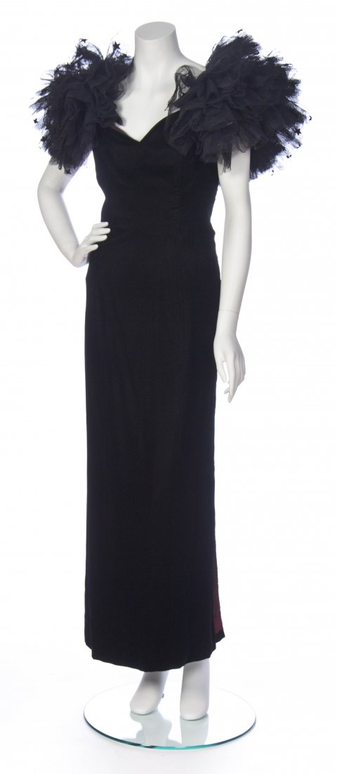 A Bellville Sassoon Black Tulle and Velvet Evening Gown: A Bellville Sassoon Black Tulle and Velvet Evening Gown, oversized tulle puff sleeves with velvet star applique. Labeled: Bellville Sassoon Made in England / Holt Renfrew Made in England. Size 16. Pro