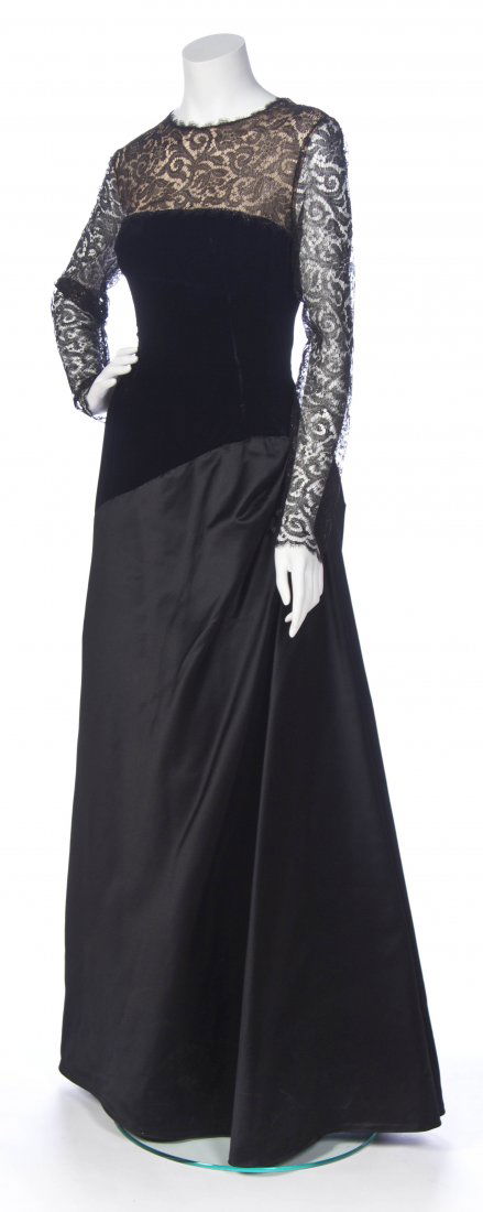 A Bill Blass Black Lace and Velvet Gown, Size 12.: A Bill Blass Black Lace and Velvet Gown, sheer lace top, black velvet bodice, and black silk full skirt. Labeled: Bill Blass Made in USA of Imported Fabric / I. Magnin. Size 12. Property from the Esta