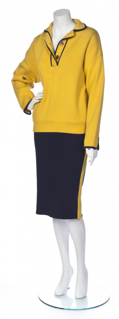 An Hermes Navy and Yellow Wool Knit Ensemble, Size 42.: An Hermes Navy and Yellow Wool Knit Ensemble, comprised of a yellow sweater with navy trim and a navy skirt with yellow side stripes. Labeled: Hermes. Size 42.