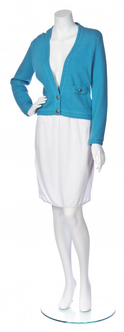 A Group of Five Chanel Sweaters,: A Group of Five Chanel Sweaters, comprised of a gold cashmere wrap sweater, a blue cashmere two button cardigan size M, a bubblegum pink cashmere single button sweater size 42, a cream with black chai