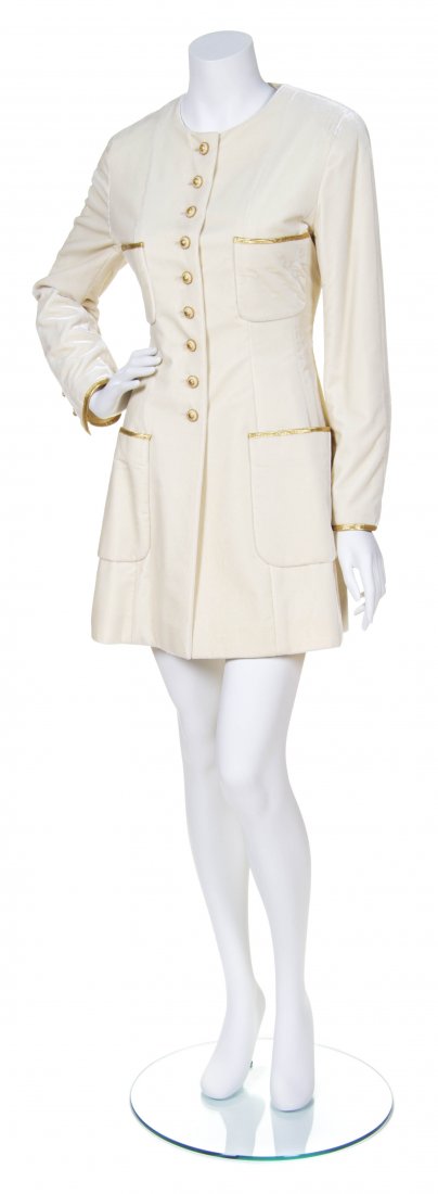 A Chanel Cream Velvet Jacket, Size 40.: A Chanel Cream Velvet Jacket, Autumn 1993, with gold passementerie trim and goldtone logo buttons. Labeled: Chanel Boutique. Size 40.