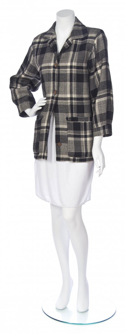 An Yves Saint Laurent Black and Cream Plaid Wool Jacket: An Yves Saint Laurent Black and Cream Plaid Wool Jacket. Labeled: Saint Laurent. Size 34. Property of a Lady, Chicago, Illinois