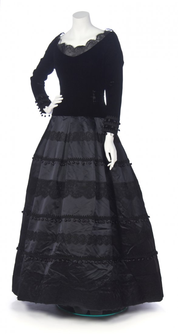 A Vera Wang Black Velvet and Satin Evening Gown,: A Vera Wang Black Velvet and Satin Evening Gown, velvet bodice and satin skirt with rows of lace and tassels. Labeled: Vera Wang. Property from the Collection of Patricia Raynes