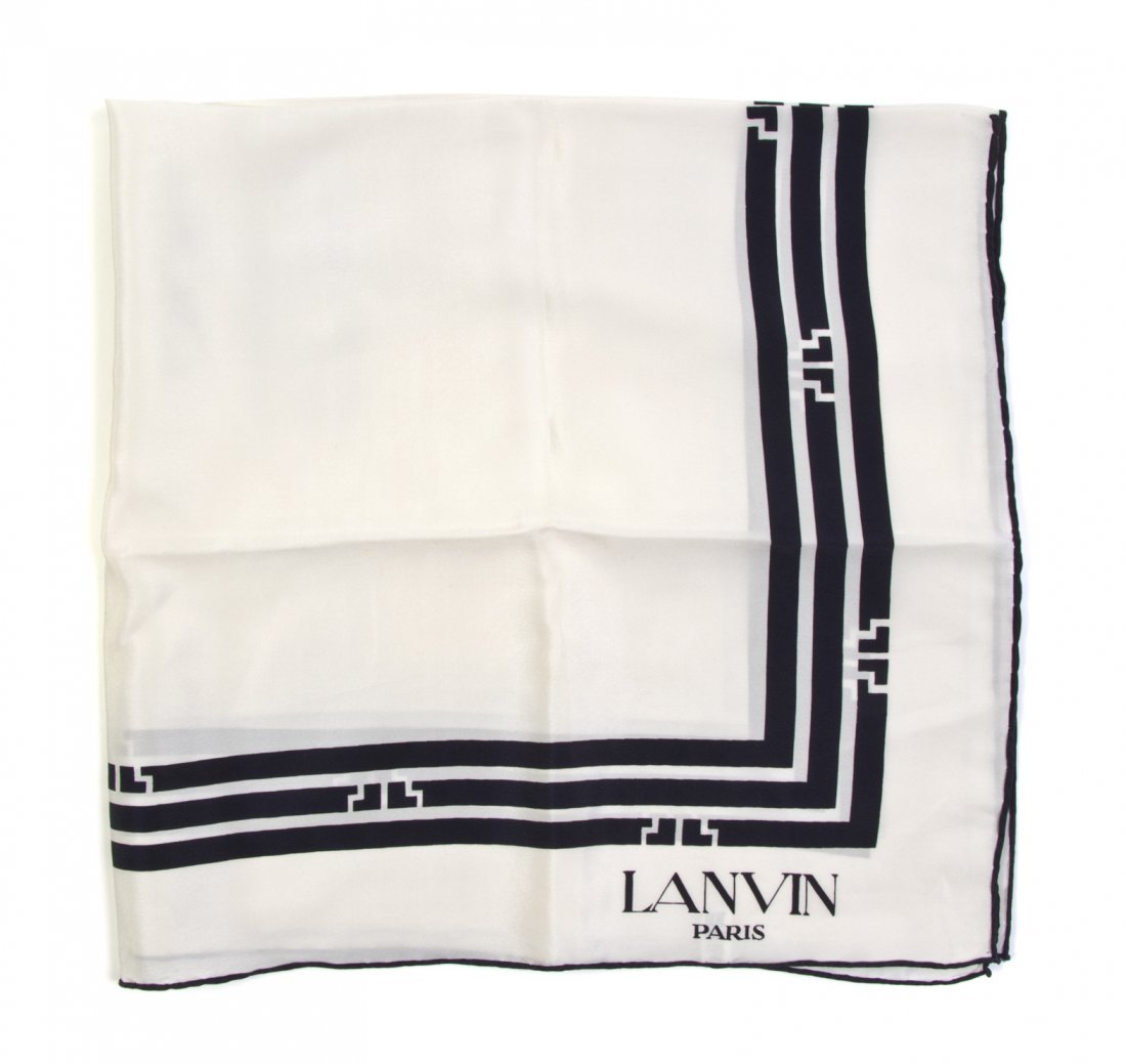 A Lanvin Silk Scarf, 27 x 27 inches.: A Lanvin Silk Scarf, in a navy blue and cream geometric motif. Labeled within print: Lanvin. 27 x 27 inches.