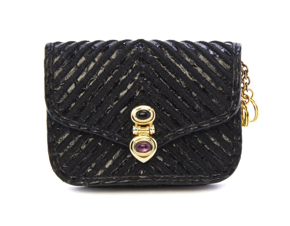 A Judith Leiber Black Cord and Leather Coin Purse, 3 1/: A Judith Leiber Black Cord and Leather Coin Purse, black and purple cabochon closure. Stamped: Judith Leiber. 3 1/2 x 2 1/2 x 1/2 inches.