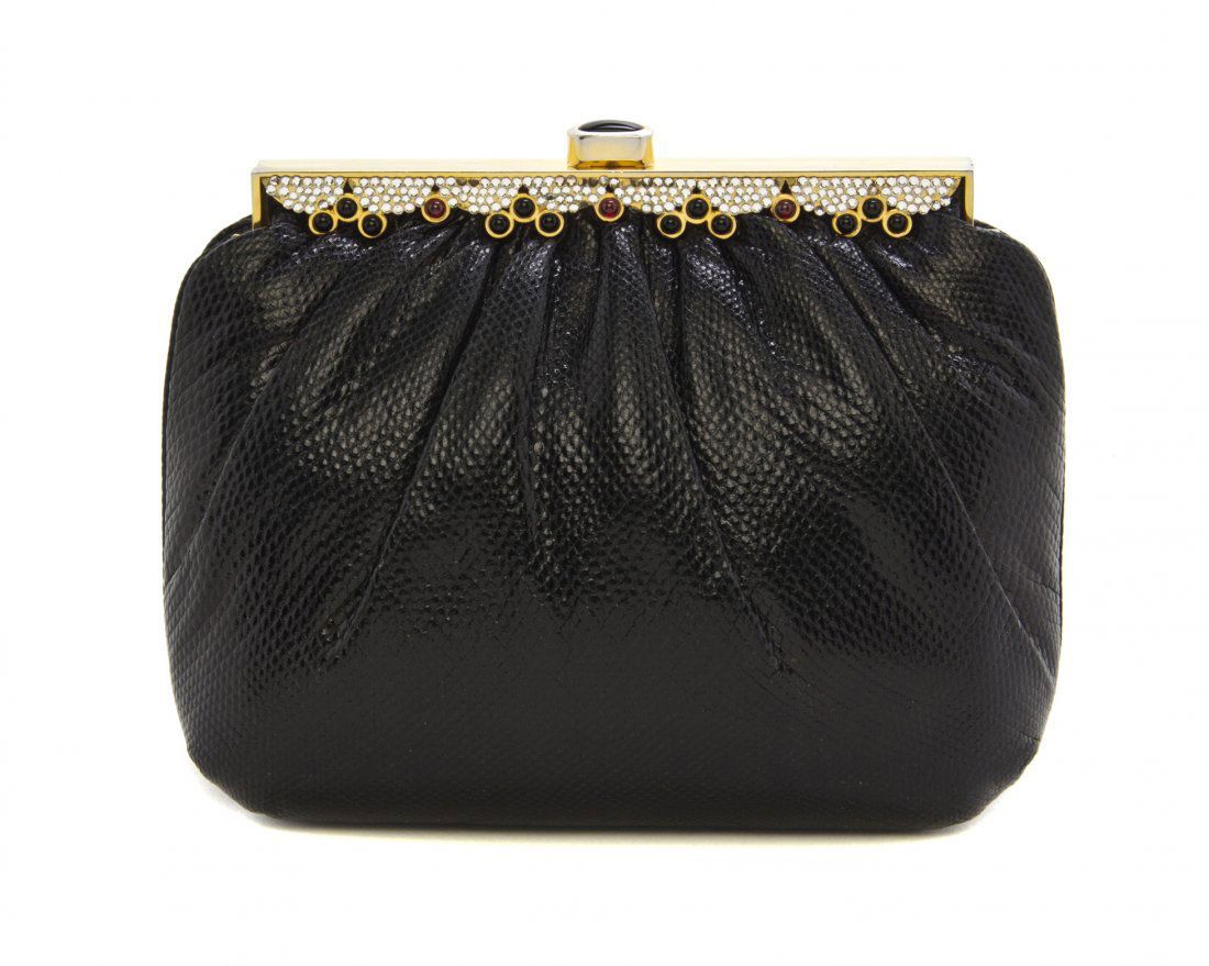A Judith Leiber Black Lizardskin Evening Bag, 8 1/2 x 6: A Judith Leiber Black Lizardskin Evening Bag, rhinestone and multicolor cabochon top frame, silk cord shoulder strap, black silk interior lining. Stamped: Judith Leiber. 8 1/2 x 6 1/2 x 3 inches.