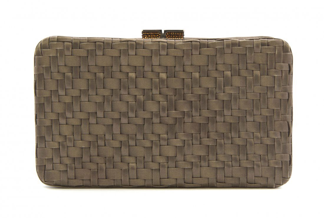 A Judith Leiber Bronze Woven Silk Evening Bag, 9 x 5 x : A Judith Leiber Bronze Woven Silk Evening Bag, with amber crystal clasp, hidden silver chain shoulder strap. Stamped: Judith Leiber. 9 x 5 x 1 inches. Property from the Dr. Myrna Salud Living Trust, M