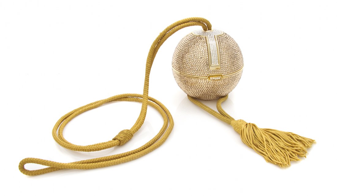 A Judith Leiber Gold Crystal Orb Minaudiere,: A Judith Leiber Gold Crystal Orb Minaudiere, gold silk cord shoulder strap, gold kid leather lining with all accessories. Stamped: Judith Leiber. Property from the Dr. Myrna Salud Living Trust, Marion