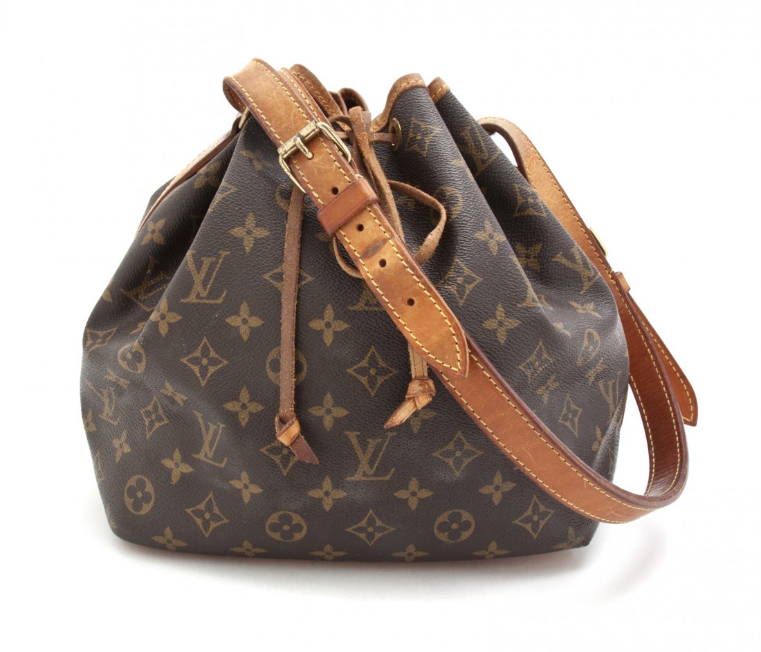 A Louis Vuitton Monogram Canvas Noe Bucket Bag, 15 x 10: A Louis Vuitton Monogram Canvas Noe Bucket Bag, tan leather trim, drawstring and adjustable shoulder strap. Stamped: Loius Vuitton. 15 x 10 x 7 inches.