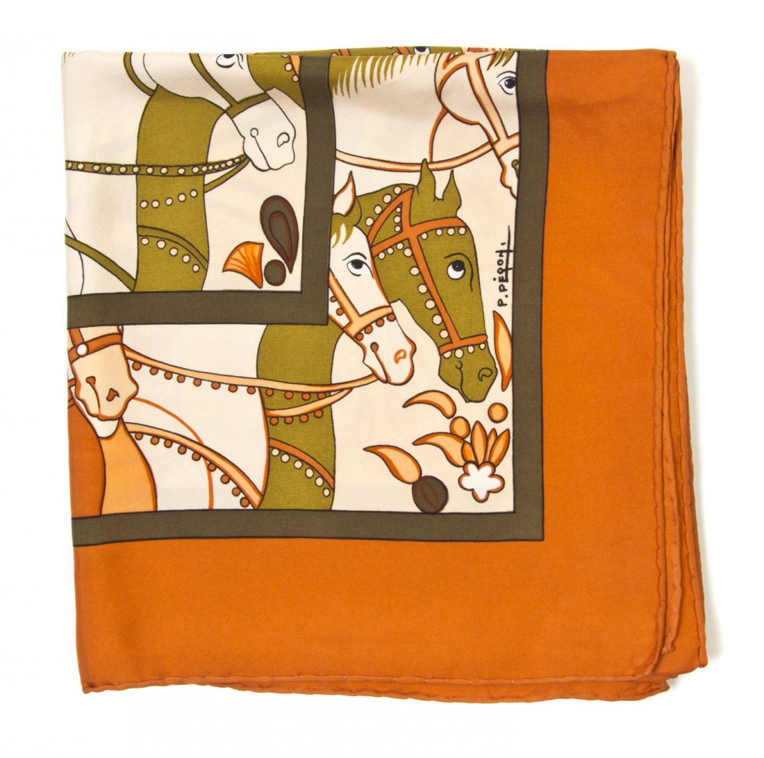An Hermes Silk Scarf, 35 x 35 inches.: An Hermes Silk Scarf, in an 'Ali Baba' motif. Labeled within print: Hermes. 35 x 35 inches.