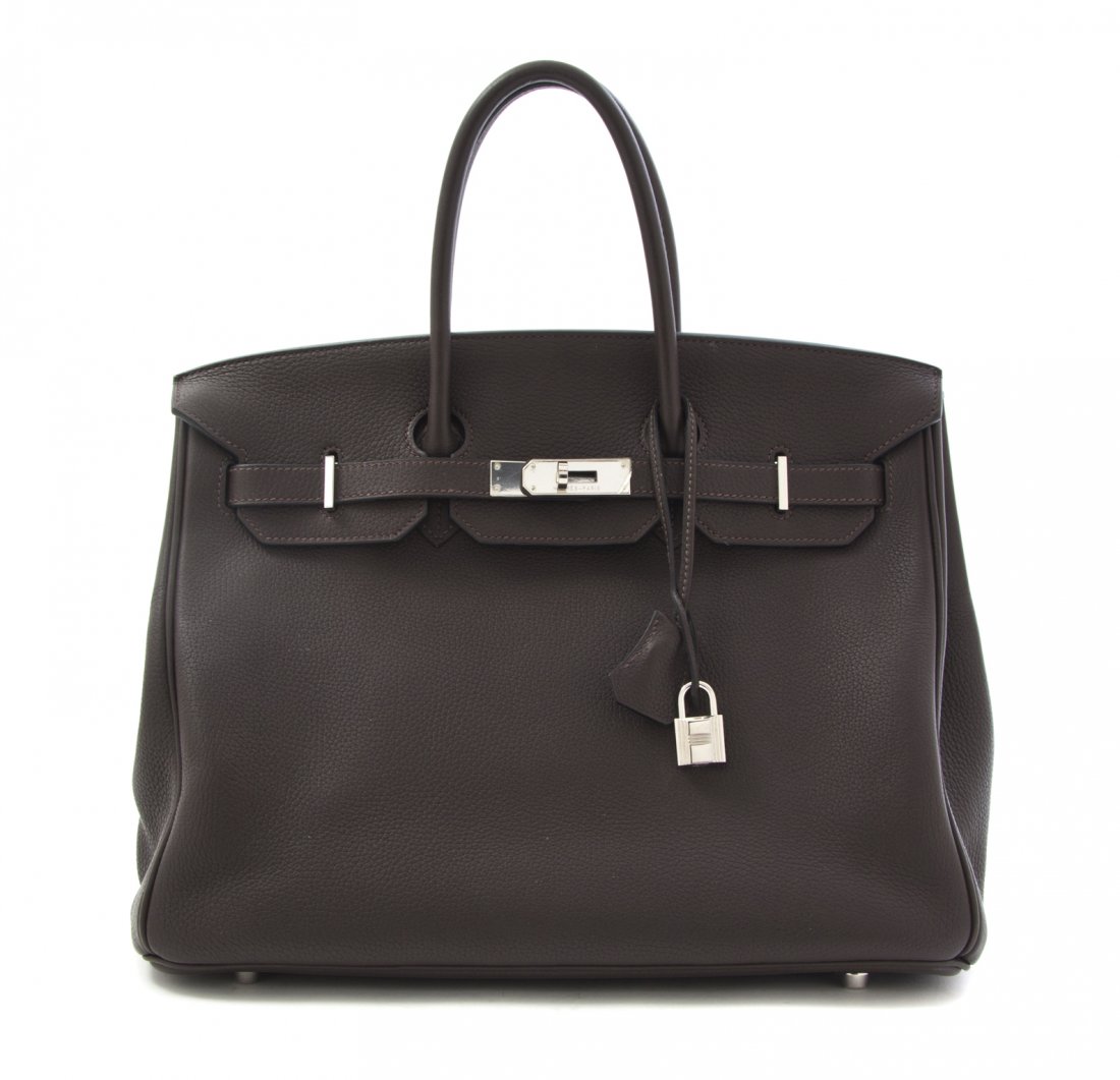 An Hermes 35cm Chocolate Brown Taurillon Clemence Leath: An Hermes 35cm Chocolate Brown Taurillon Clemence Leather Birkin Bag, 2008, palladium hardware, lock and key sheath, blindstamp square L. Stamped: Hermes. 35 x 27 x 19 cm (14 x 10 1/2 x 7 1/2 inches).