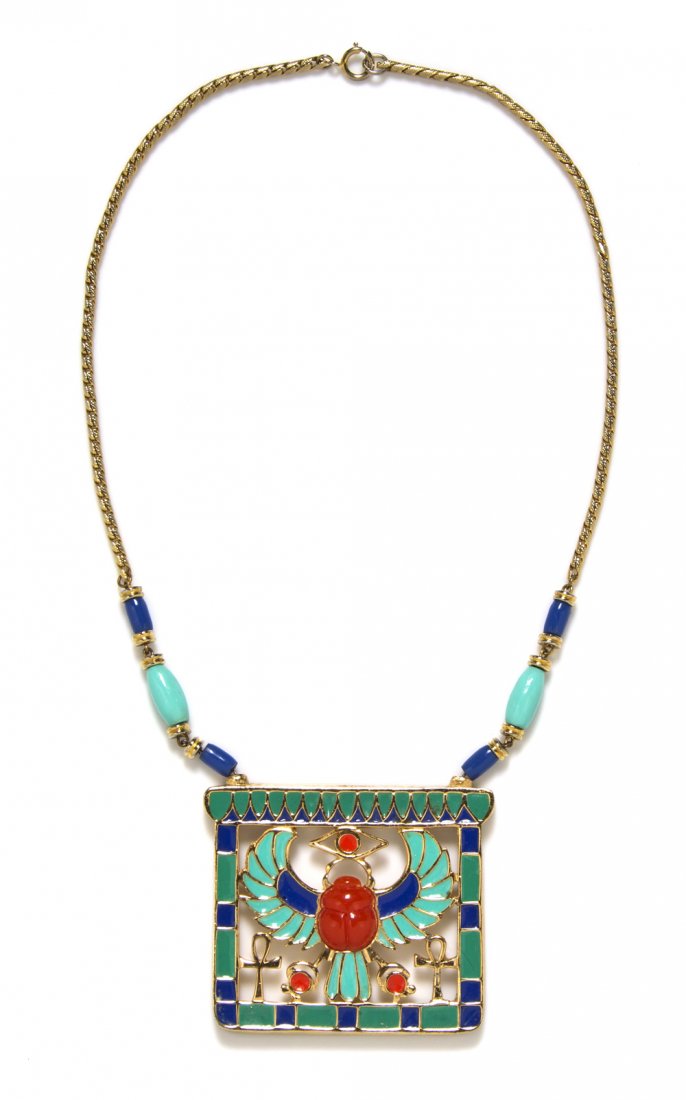 A Hattie Carnegie Polychrome Enamel Egyptian Revival Pe: A Hattie Carnegie Polychrome Enamel Egyptian Revival Pendant Necklace, with turquoise and blue enamels and a carved faux coral scarab in the center. Stamped: Hattie Carnegie.