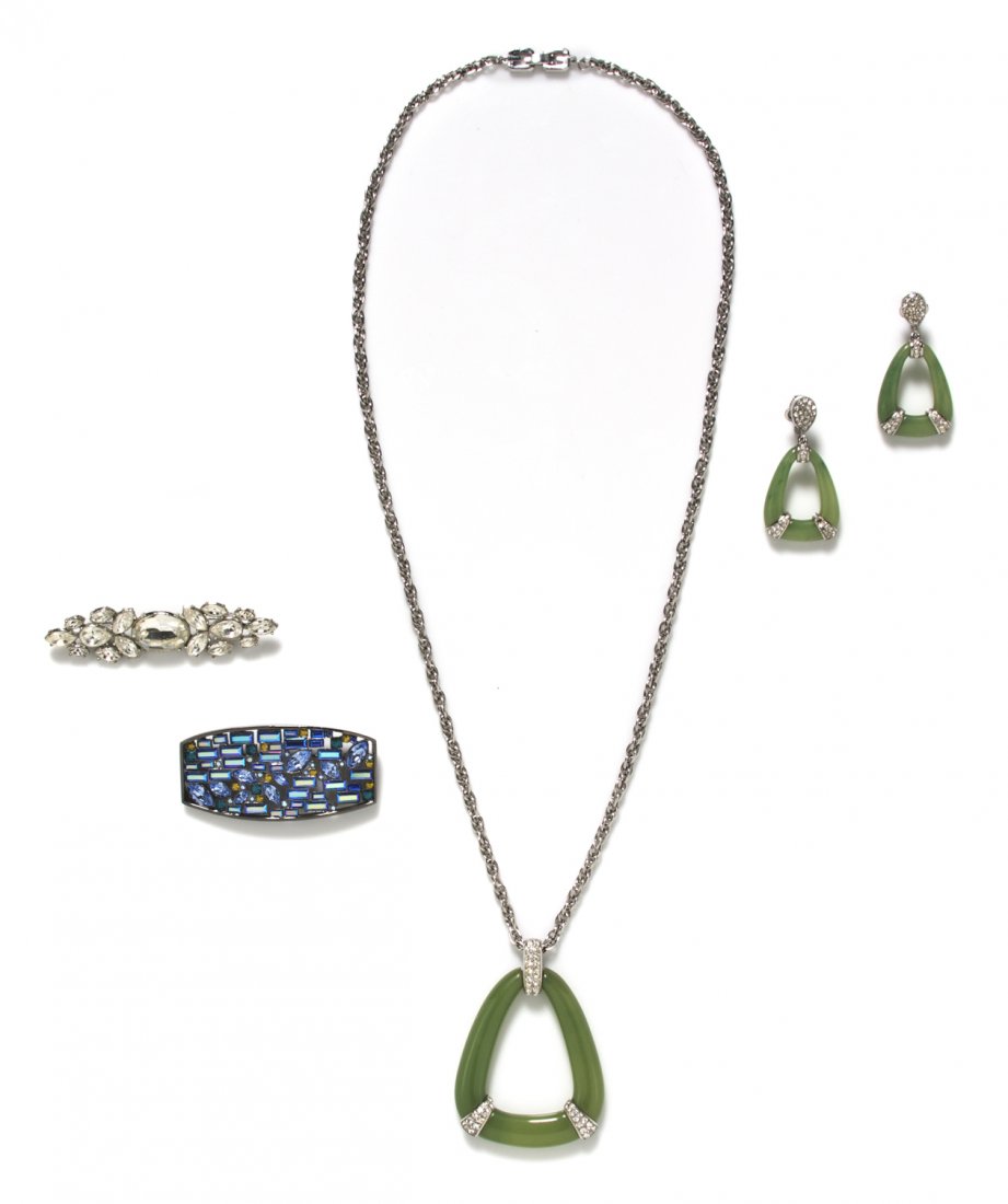 A Group of Givenchy Costume Jewelry,: A Group of Givenchy Costume Jewelry, comprised of a faux jade and rhinestone suite consisting of a necklace and earclips, a multicolor rhinestone brooch, and a white rhinestone brooch in a foliate mot