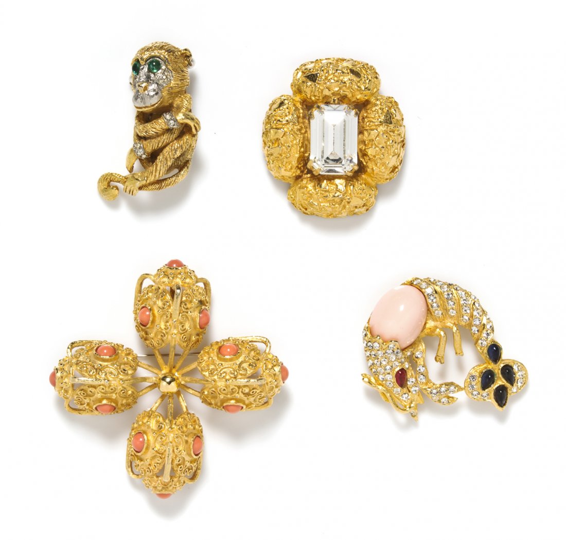 A Group of Four Kenneth Jay Lane Brooches,: A Group of Four Kenneth Jay Lane Brooches, comprised of a two tone monkey, a faux coral and rhinestone shrimp, a textured goldtone and large rhinestone cross and a textured goldtone and faux coral cab