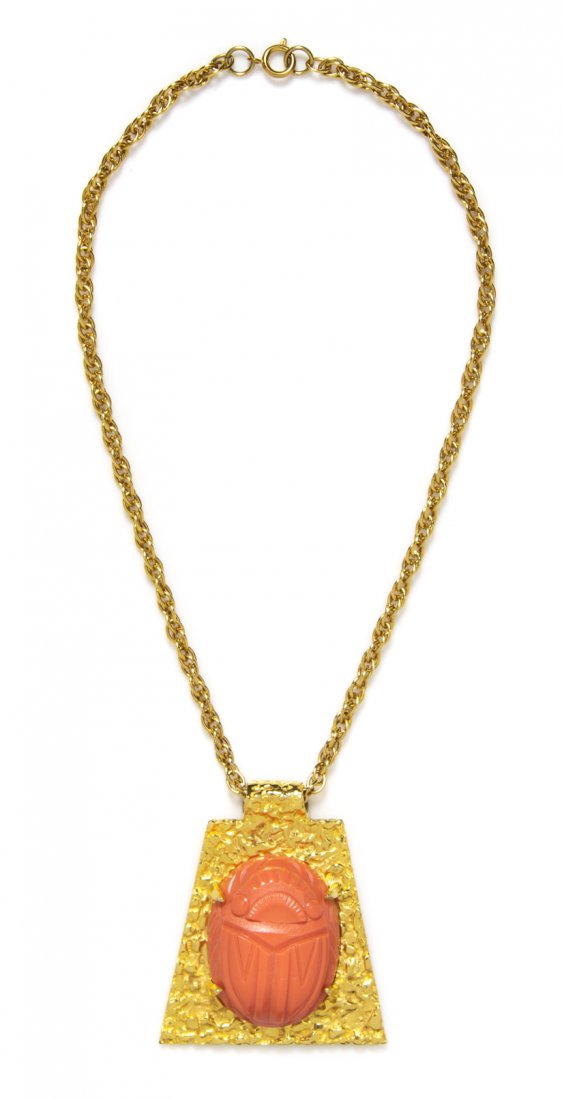 A Kenneth Jay Lane Goldtone and Faux Coral Scarab Penda: A Kenneth Jay Lane Goldtone and Faux Coral Scarab Pendant Necklace. Stamped: K.J.L. Property from an Important Collector, Chicago, Illinois