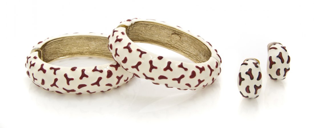 A Kenneth Jay Lane Cream and Red Enamel Suite,: A Kenneth Jay Lane Cream and Red Enamel Suite, comprised of two bangle bracelets and a pair of earclips. Stamped: Kenneth Lane. Property from an Important Collector, Chicago, Illinois