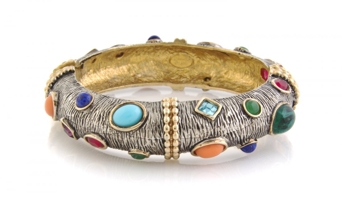 A Kenneth Jay Lane Multigem Hinged Bangle Bracelet,: A Kenneth Jay Lane Multigem Hinged Bangle Bracelet, textured silvertone metal with goldtone accents and multigem cabochons allover. Stamped: Kenneth Lane. Property from an Important Collector, Chicago