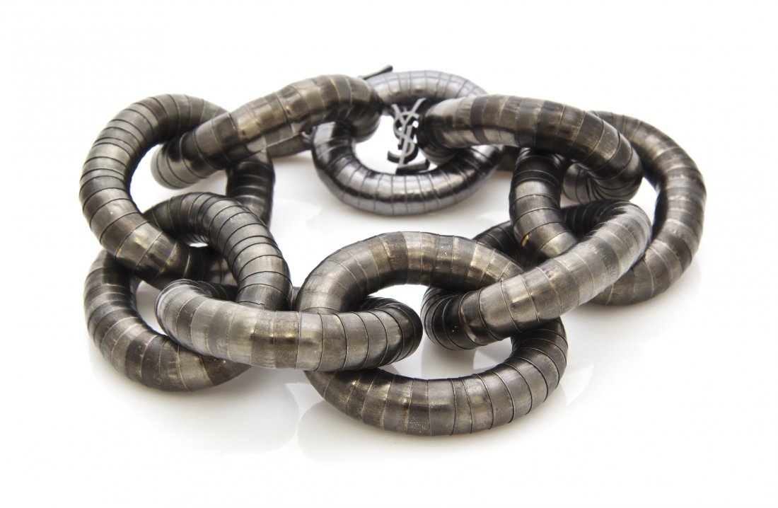 An Yves Saint Laurent Pewter Oversized Flexible Chain L: An Yves Saint Laurent Pewter Oversized Flexible Chain Link Bracelet. Stamped: YSL.
