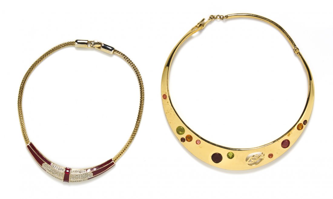A Collection of Two Goldtone Collar Necklaces,: A Collection of Two Goldtone Collar Necklaces, comprised of a Christian Lacroix multigem necklace stamped Christian Lacroix and a Geoffrey Beene red enamel and rhinestone necklace stamped Geoffrey Bee