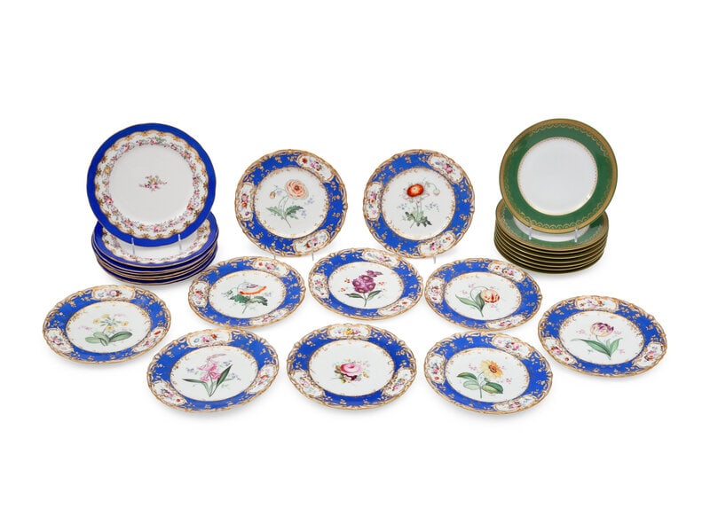 Three Sets of Porcelain Dinner Plates: Three Sets of Porcelain Dinner Plates 20th Century comprising a set of eight with green and gilt borders marked for Charles Ahrenfeldt, Limoges; a set of eight with royal blue and painted floral borde