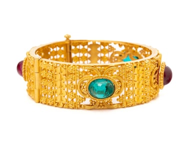 HIGH KARAT GOLD AND SYNTHETIC GEMSTONE BANGLE BRACELET