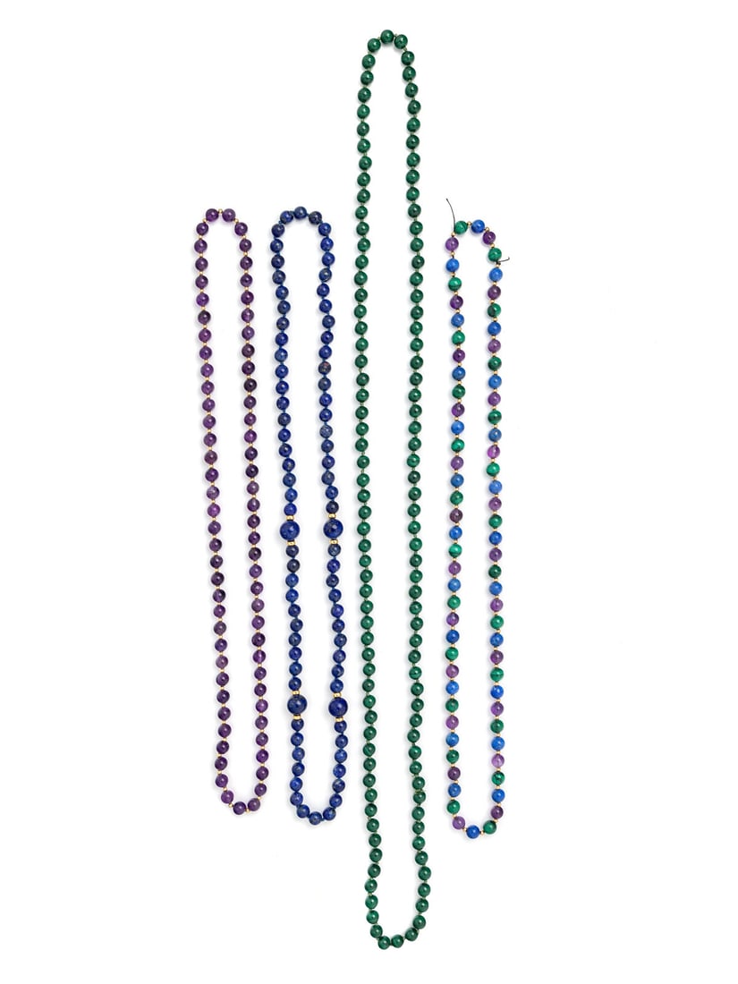 COLLECTION OF BEADED NECKLACES: COLLECTION OF BEADED NECKLACES Including four beaded necklaces in amethyst, lapis lazuli, and malachite with beads ranging from 7.75 - 11.95 mm. 28 1/2 - 42 1/2 inches long. Gross weight: 197.20 dwt.