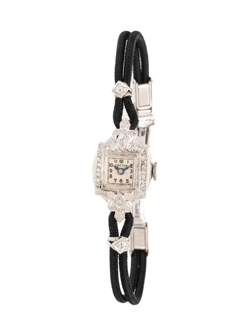 CROTON, ART DECO, DIAMOND AND WHITE GOLD WATCH: CROTON, ART DECO, DIAMOND AND WHITE GOLD WATCH Maker: Croton Year: Circa 1920s Case size: Approx. 18.25 x 12.50 mm Case material: White gold Bezel: Single cut diamonds Dial: White Movement: Manual win