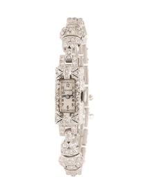 GENEVE, ART DECO, DIAMOND AND PLATINUM WATCH