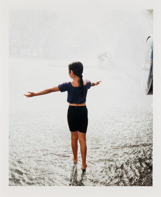 Paul D'Amato (American, b.1956) Girl in Spray, Chicago, 1993; printed 2006: Paul D'Amato (American, b.1956) Girl in Spray, Chicago, 1993; printed 2006 archival inkjet photograph signed, titled, bearing negative date, and numbered 3/10 in pencil 39 1/2 x 32 1/2 inches. </