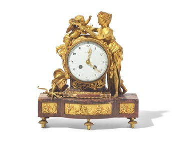 A Louis XVI Style Gilt-Bronze Mounted Rouge Marble Mantel Clock
