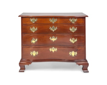 A Chippendale Mahogany Reverse-Serpentine Chest of Drawers