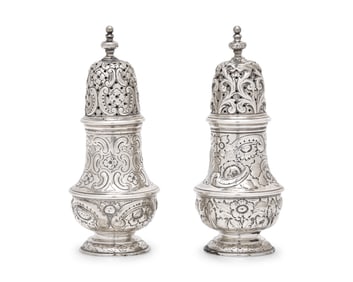 A Pair of Repousse Coin Silver Casters
